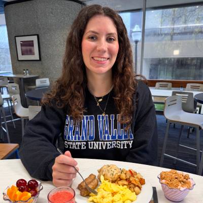 Student eating breakfast at Fresh Food Co